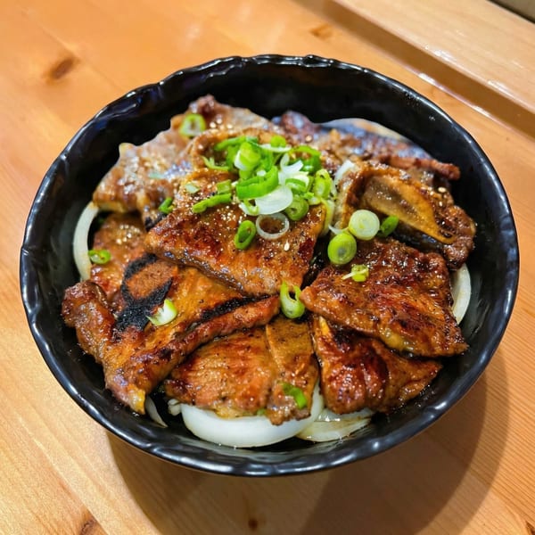 Izziban Sushi & BBQ's Korean BBQ short ribs, garnished with green onions and sesame seeds.
