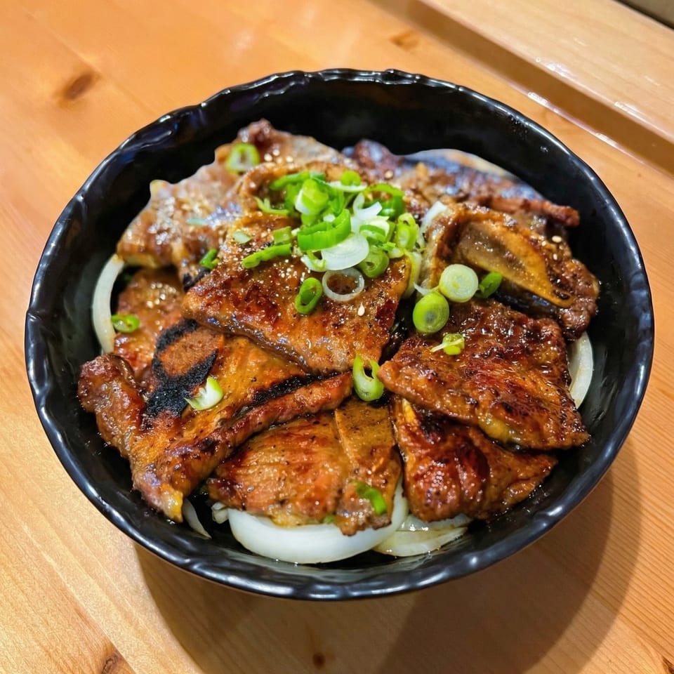 Izziban Sushi & BBQ's Korean BBQ short ribs, garnished with green onions and sesame seeds.
